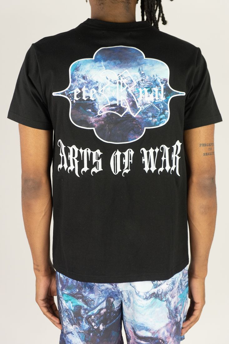 Person wearing a black t-shirt with 'Arts of War' design on a plain background