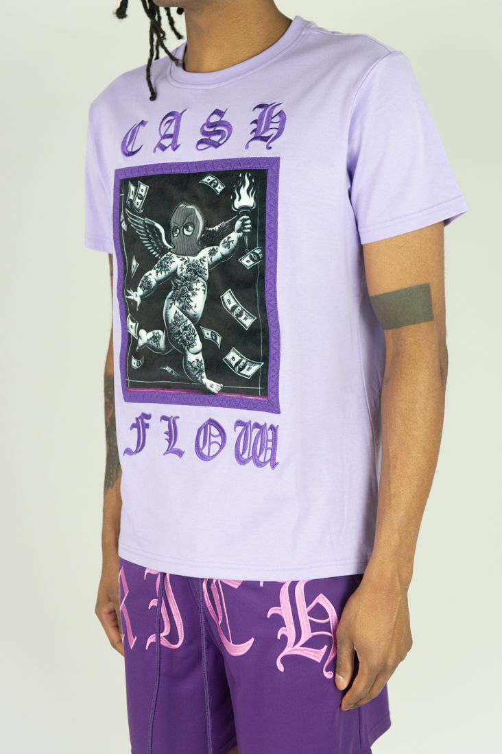 Person wearing a purple t-shirt with graphic design and text on a plain background