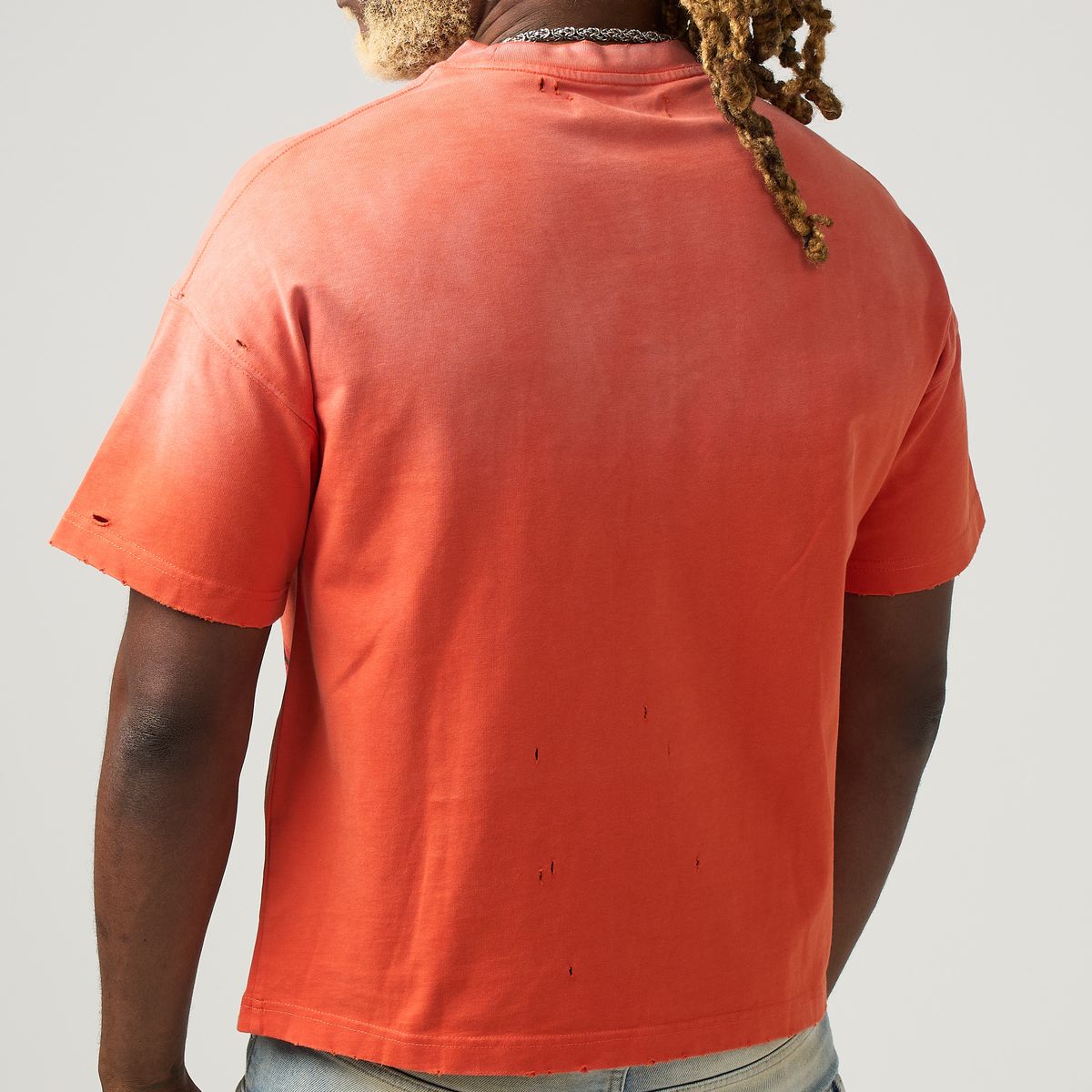 DUAA Trophy orange tee back view distressed cotton