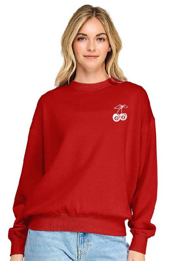 Person wearing a red sweatshirt with a logo on a white background