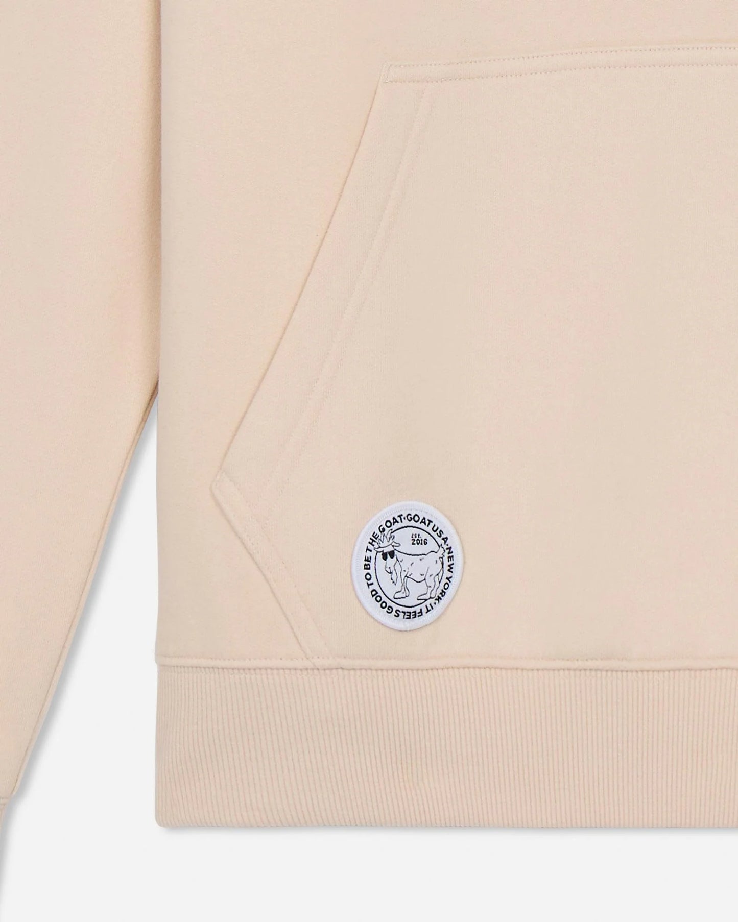 Beige fabric with a logo patch on a white background
