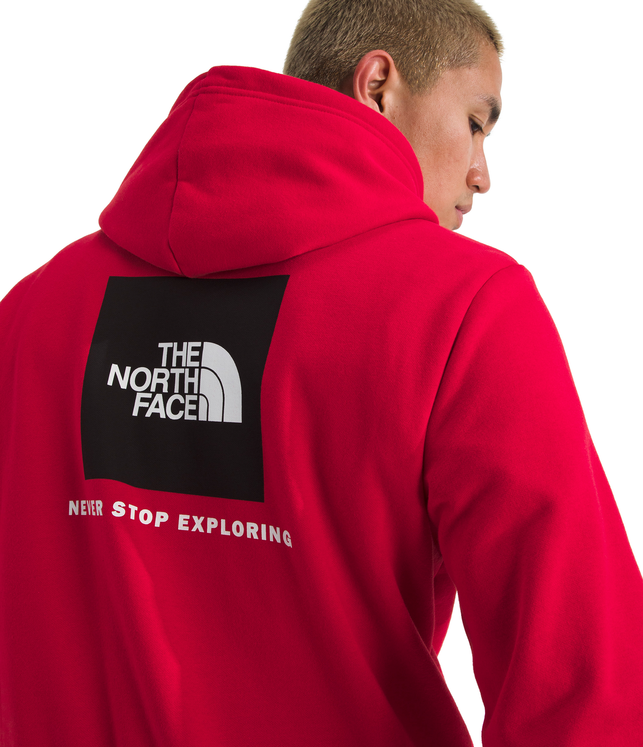 Person wearing a red hoodie with The North Face logo on the back