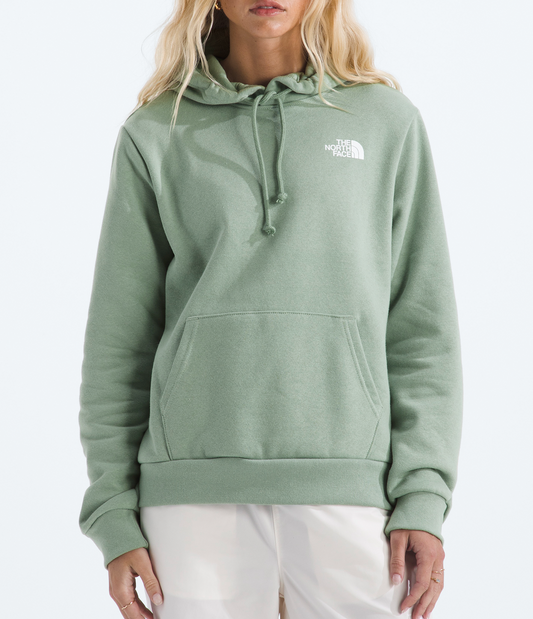 Person wearing a green hoodie with a brand logo on a white background