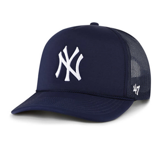 A navy blue '47 Mesh Trucker' cap with the New York Yankees logo embroidered in white on the front.