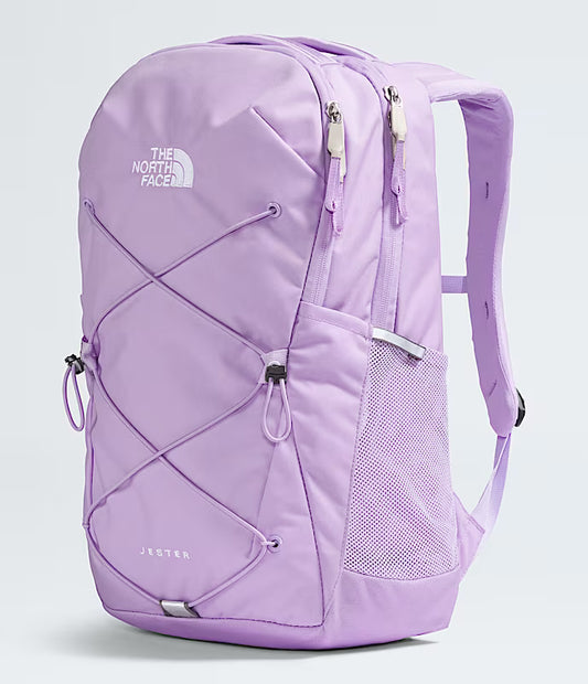 Purple backpack with The North Face logo on a light gray background
