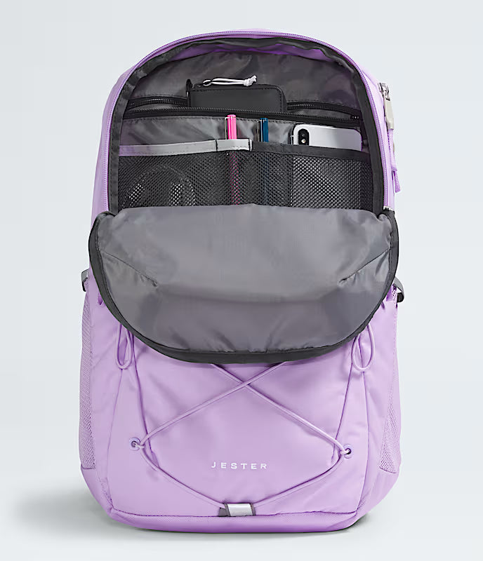 Purple backpack with open compartments on a light gray background