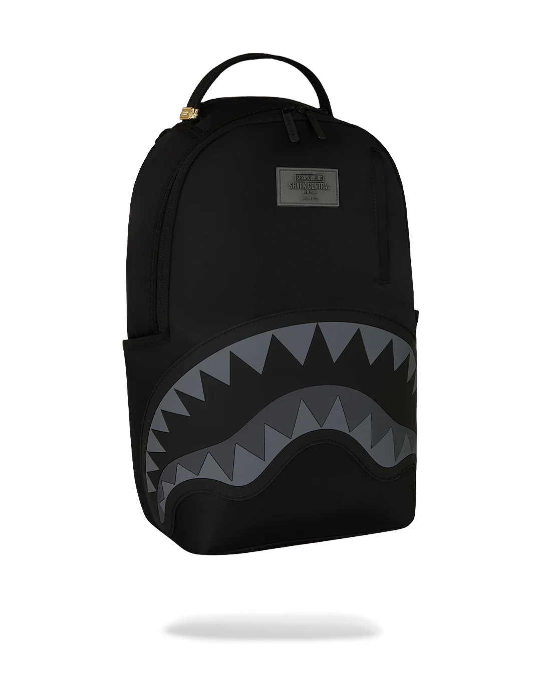 Black backpack with shark mouth design on a white background
