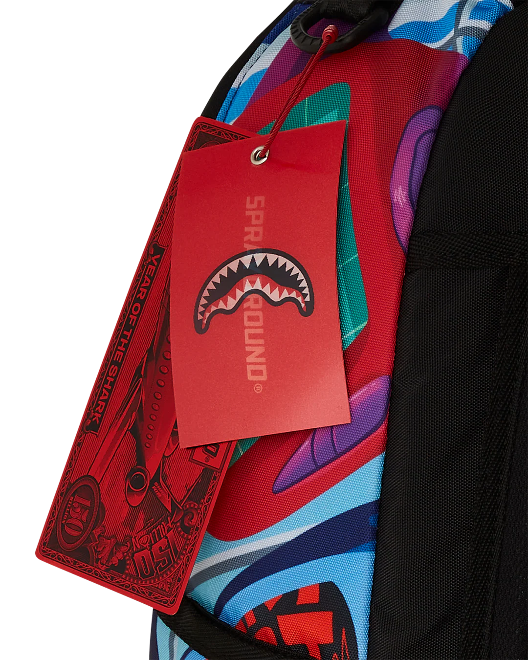 Colorful backpack with a brand tag featuring a shark logo on a white background