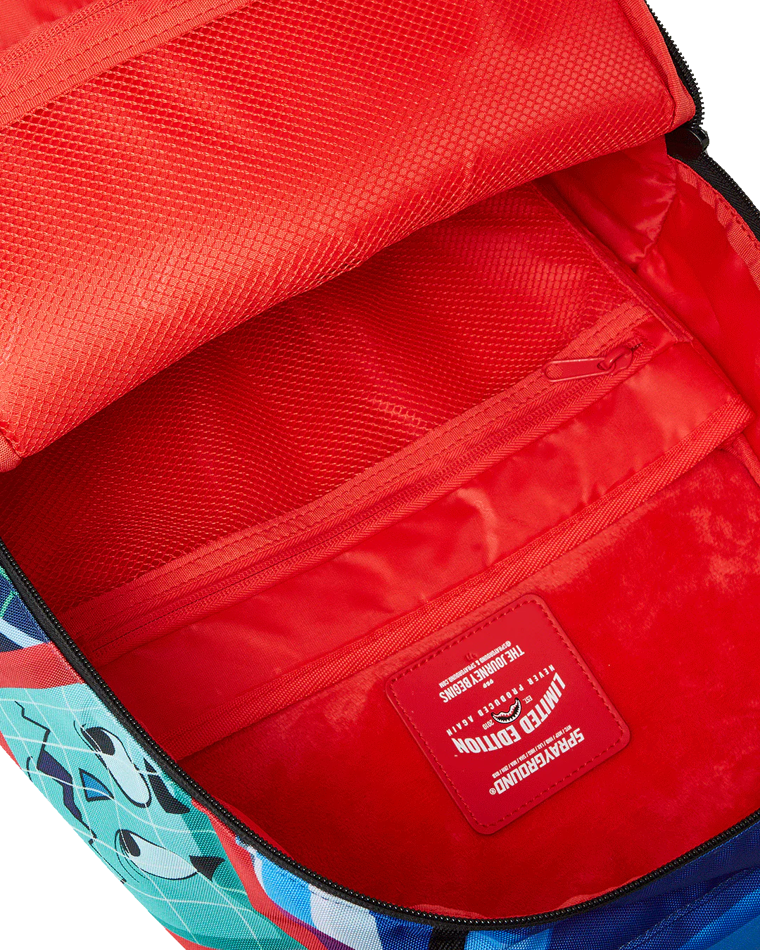 Red backpack with a visible brand logo on a multicolored background