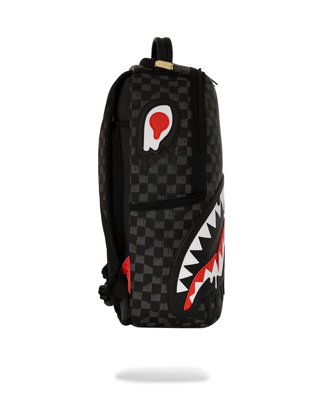 Black checkered backpack with a shark mouth design on a white background