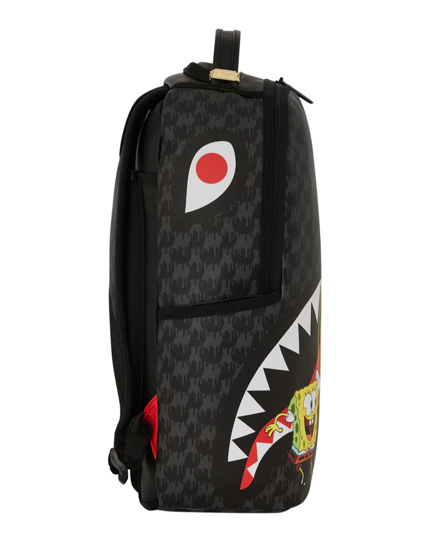 Black backpack with shark mouth design and colorful accents on a white background