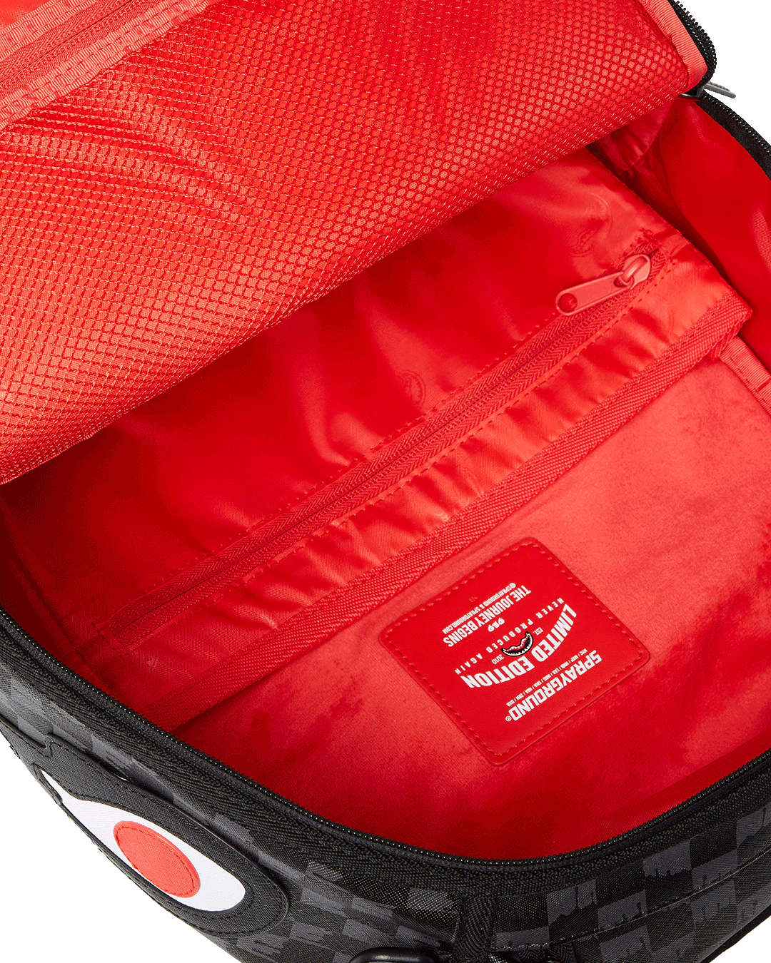 Red interior of a bag with a visible brand label