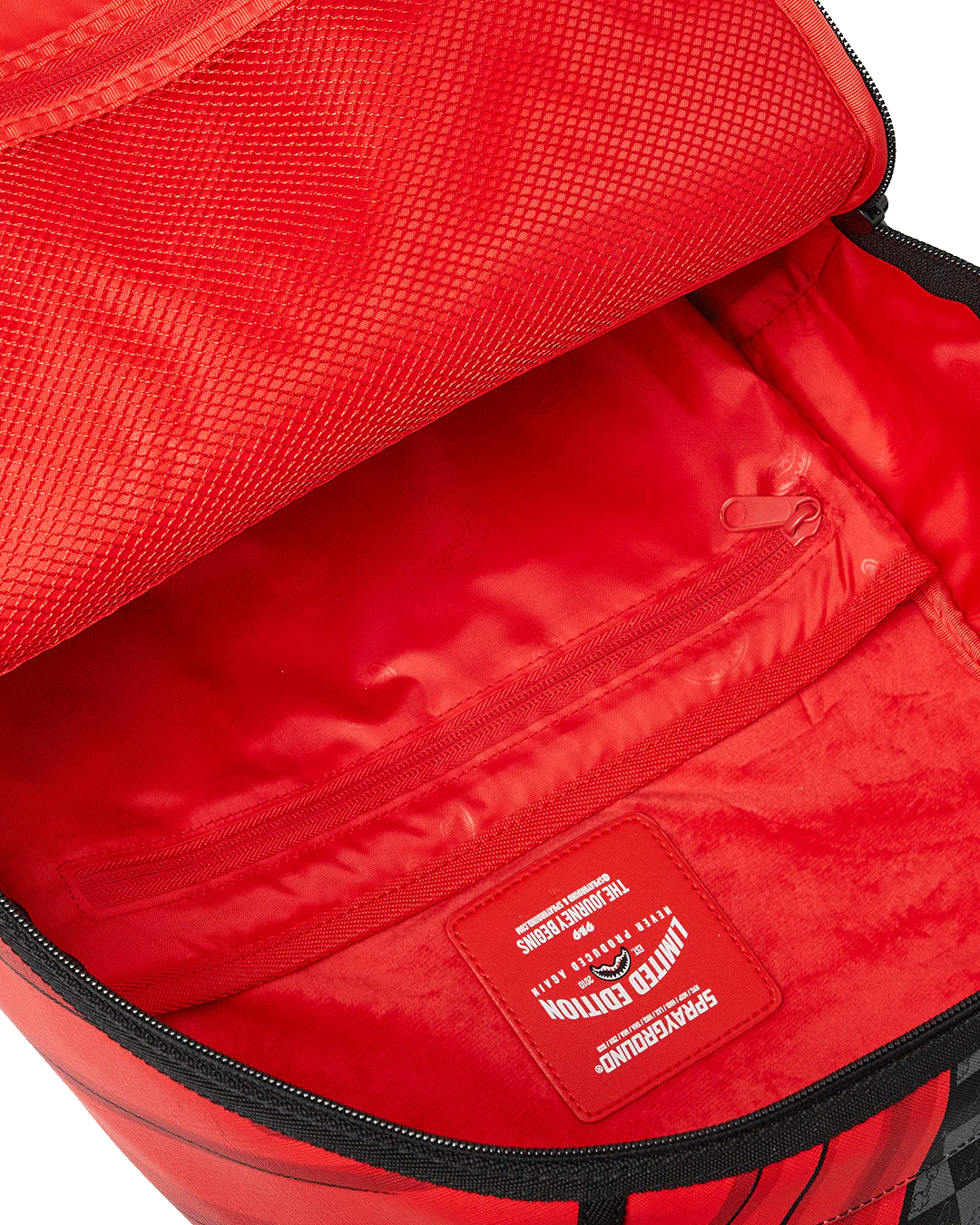 Red backpack with a visible brand logo on a white background