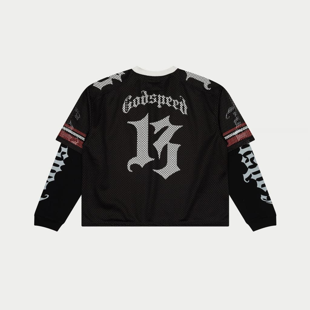 Black long-sleeve shirt with white text and designs on a light gray background