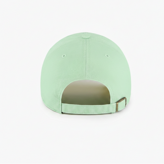 A rear view of a mint green baseball cap with an adjustable strap and a metal buckle closure, highlighting its smooth fabric and subtle stitching.