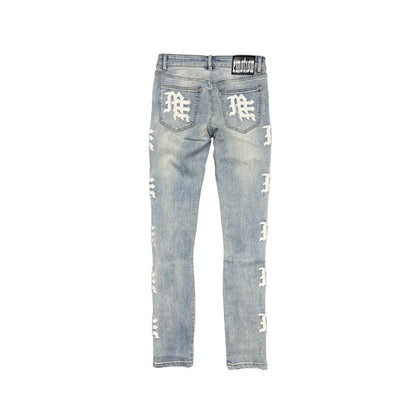 Light blue distressed jeans with white branding on a white background