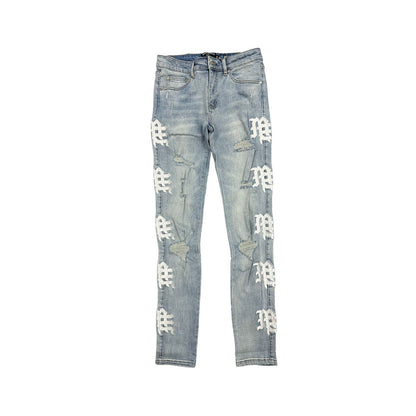 Light blue jeans with white patterns on a white background