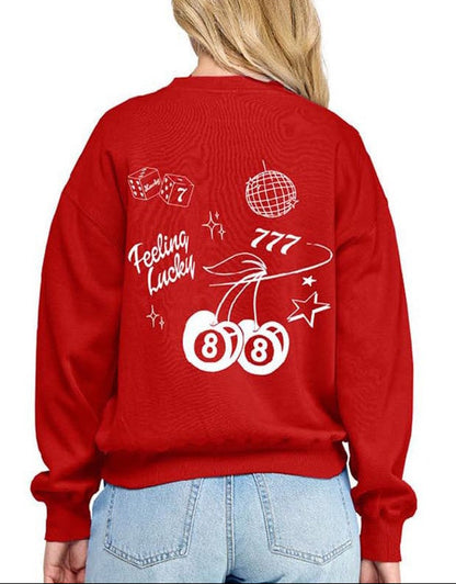 Red sweatshirt with white graphics and text worn by a person on a white background