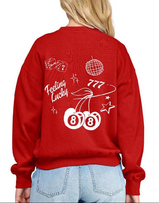 Red sweatshirt with white graphics and text worn by a person on a white background
