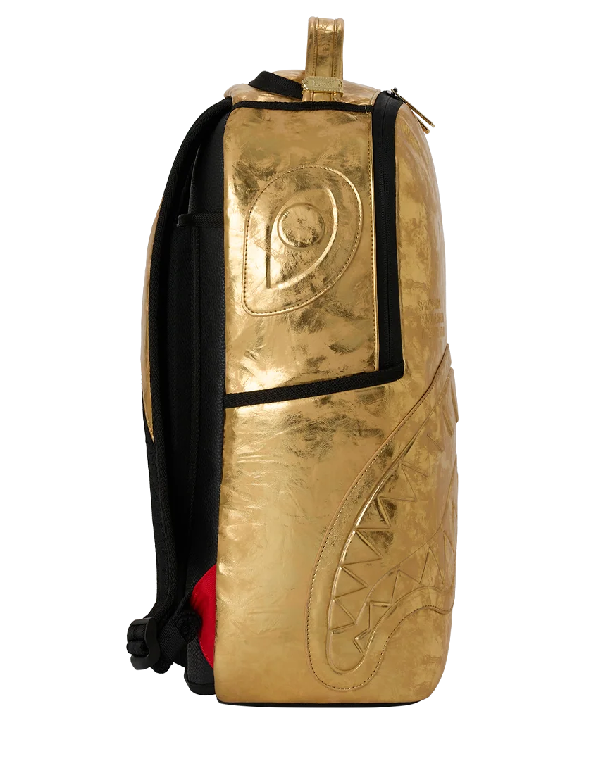 Gold backpack with black straps on a white background