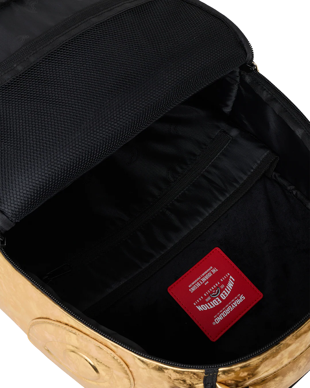 Close-up of a backpack interior with a red label on a white background
