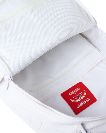 Close-up of an open white backpack showing the interior lining and a red interior brand patch that reads Limited Edition.