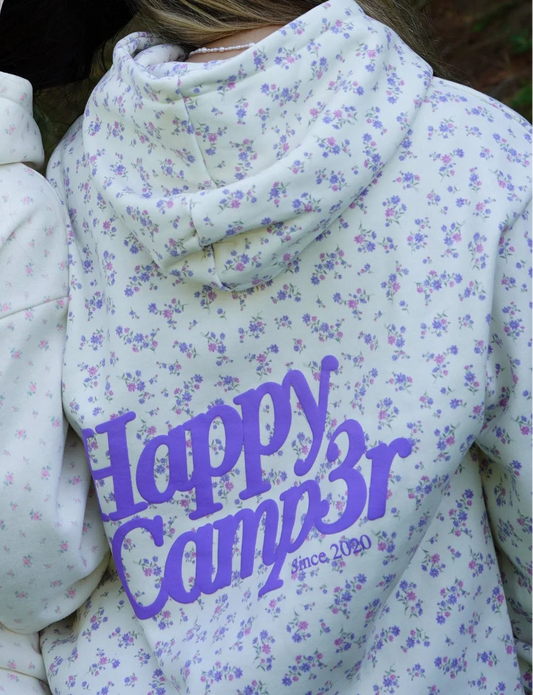 Floral-patterned hoodie with 'Happy Camper' text on a floral background