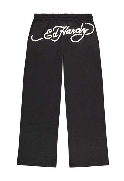 Black pants with white 'Ed Hardy' logo on a white background