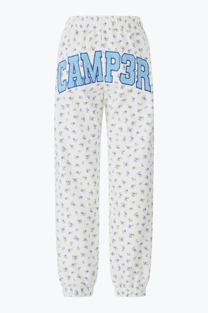 Floral-patterned pants with 'CAMP3R' text on a white background
