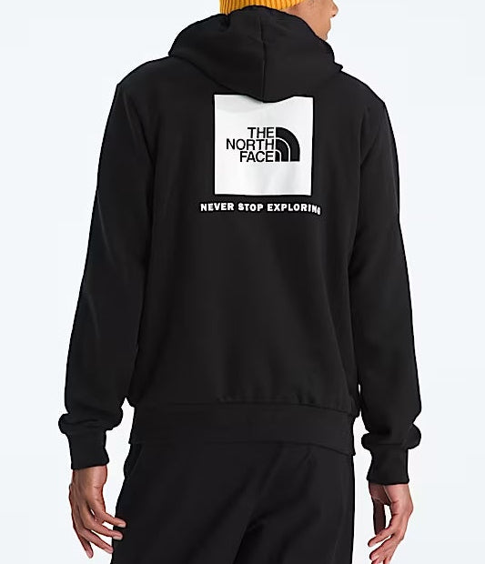 Person wearing a black hoodie with The North Face logo and text, standing against a white background.  
