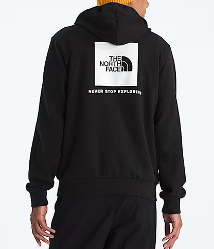 Person wearing a black hoodie with The North Face logo and text, standing against a white background.  