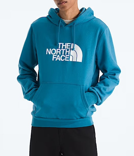 Person wearing a blue The North Face hoodie on a white background
