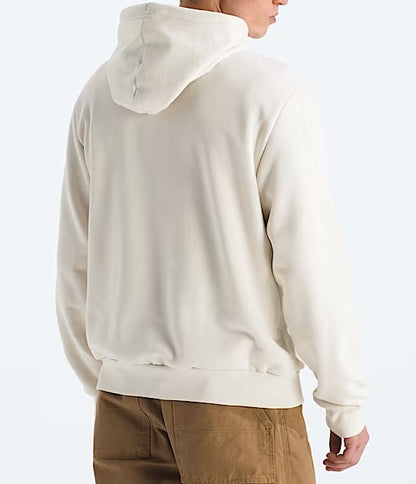 Person wearing a beige hoodie from behind on a white background