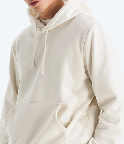 Man wearing a beige hoodie on a white background
