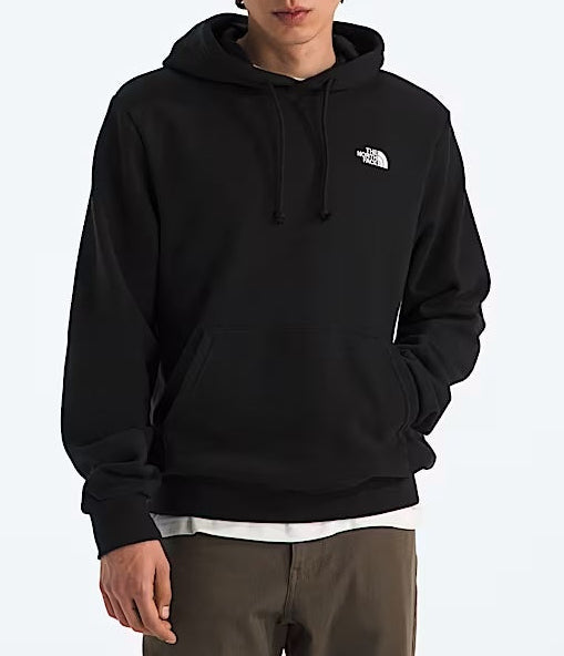 Person wearing a black hoodie with a logo and a brown beanie on a white background
