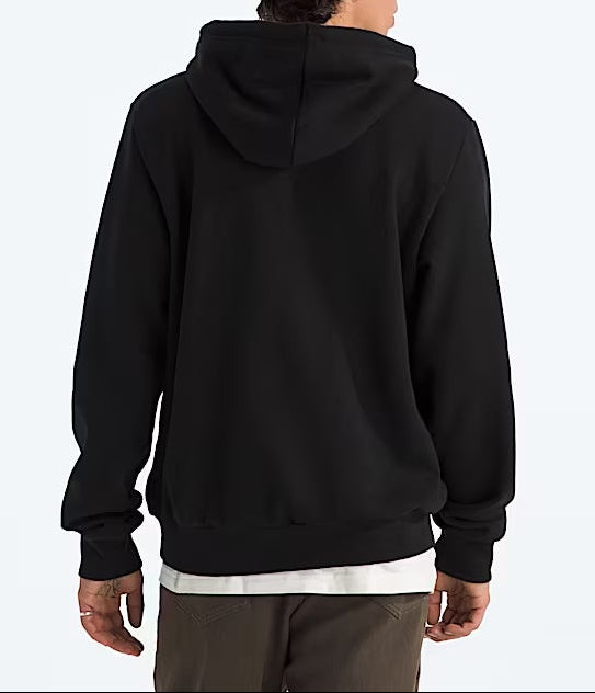Person wearing a black hoodie and brown beanie from behind on a white background