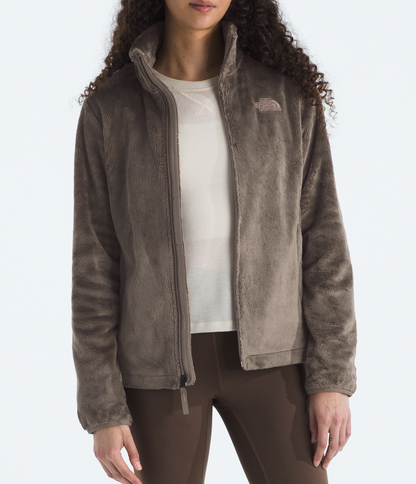 Person wearing a brown jacket on a white background