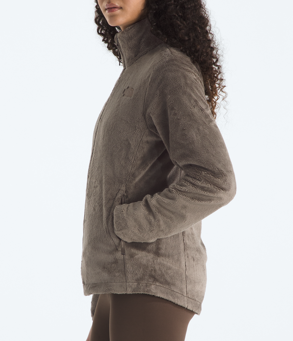 Woman wearing a brown fleece jacket on a white background