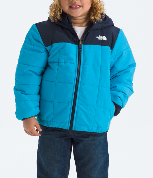 Child wearing a blue and navy winter jacket with The North Face logo on a white background