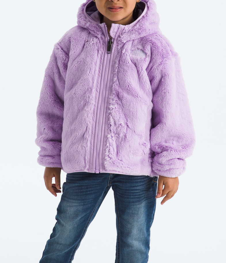 Child wearing a purple jacket and beanie on a white background 