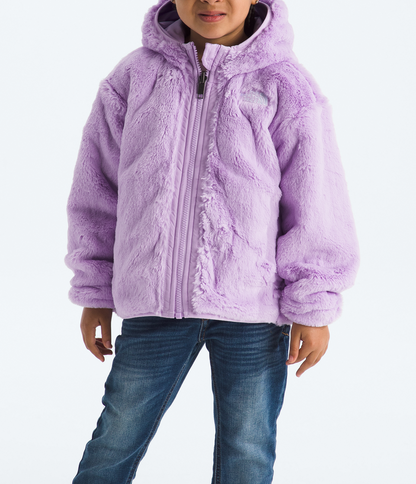 Child wearing a purple jacket and beanie on a white background 
