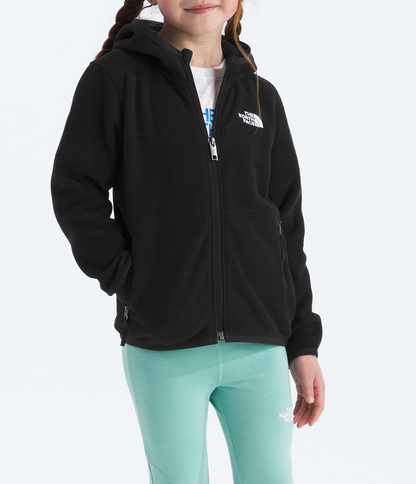 Young girl wearing a black hoodie and light green pants on a white background