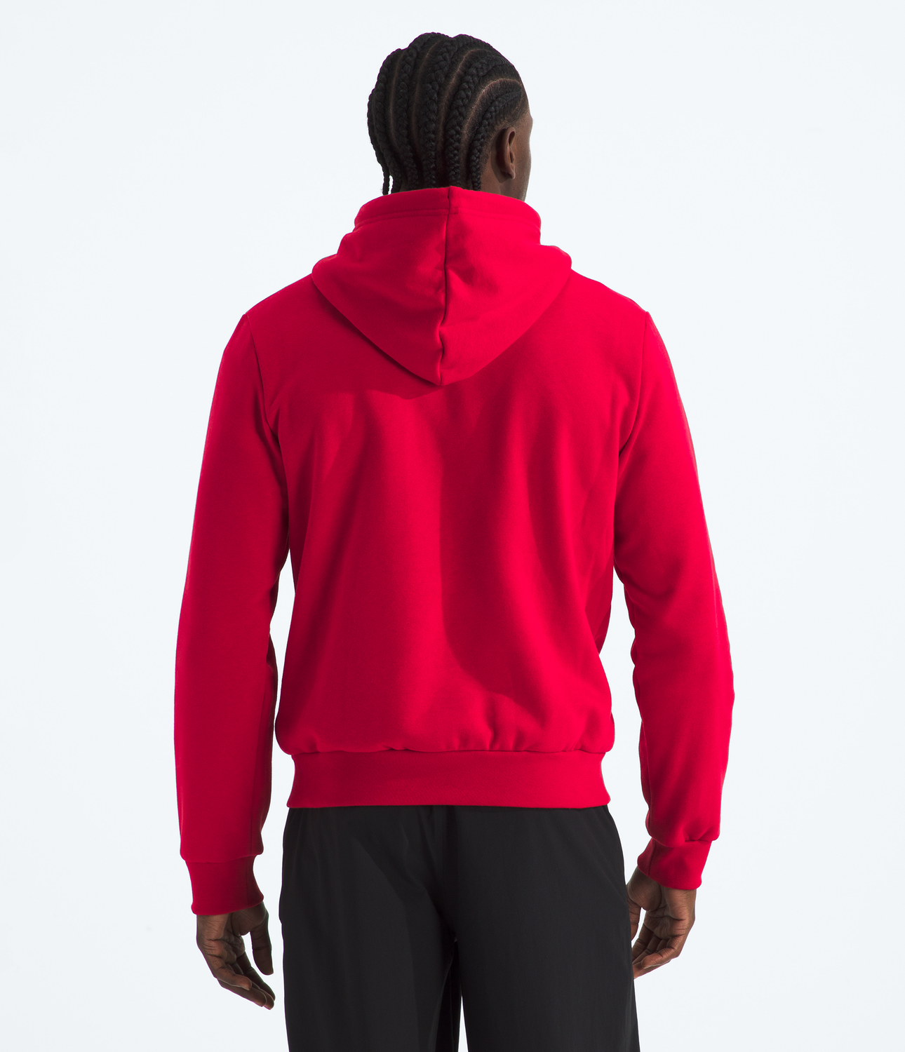 Person wearing a red hoodie on a white background