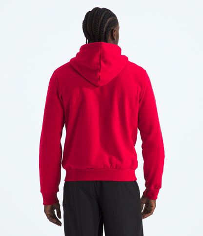 Person wearing a red hoodie on a white background