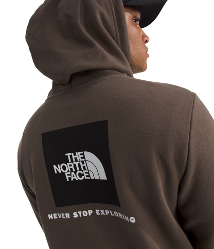 Person wearing a brown hoodie with The North Face logo on the back