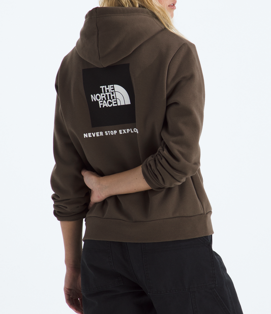 Person wearing a brown The North Face hoodie with a logo on the back against a white background