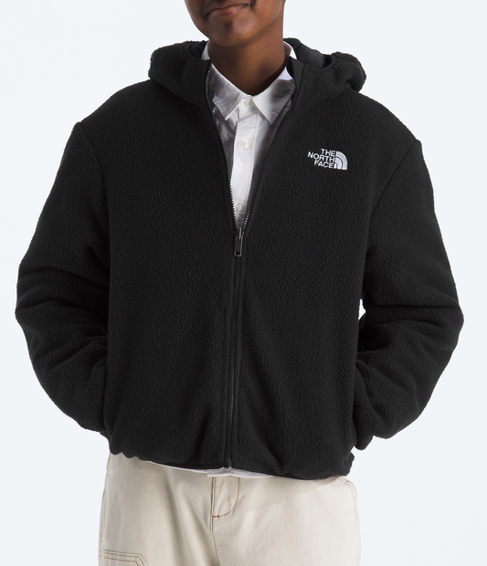 Person wearing a black The North Face jacket on a white background