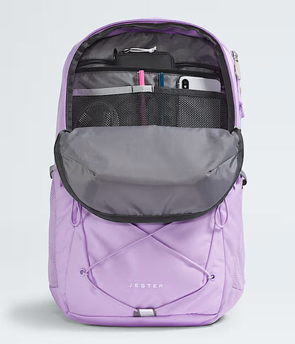 Purple backpack with open compartments on a light gray background