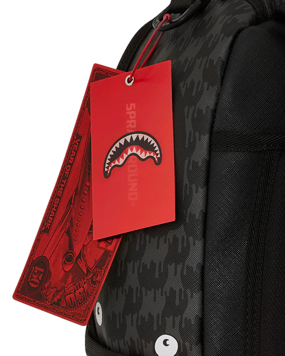 Black backpack with red tags featuring a shark logo on a white background