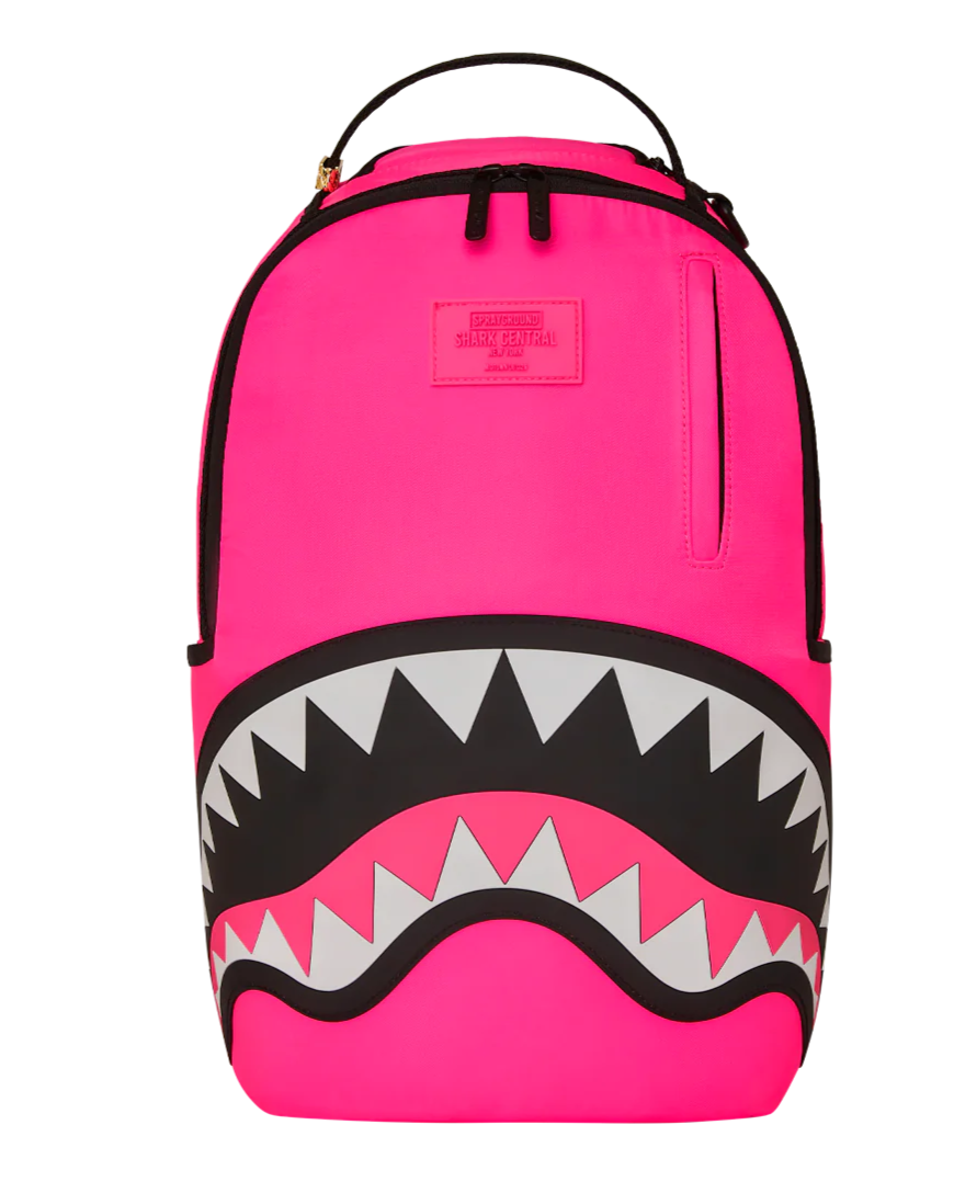 Pink backpack with shark mouth design on a white background